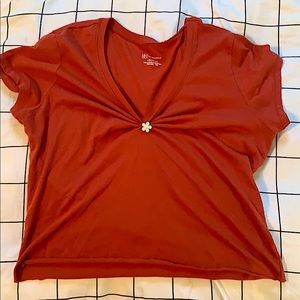 Cropped reddish orange shirt